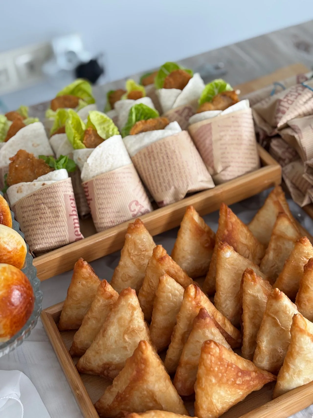 Party catering with samosas and wrapped rolls for guests (illustrative photo)